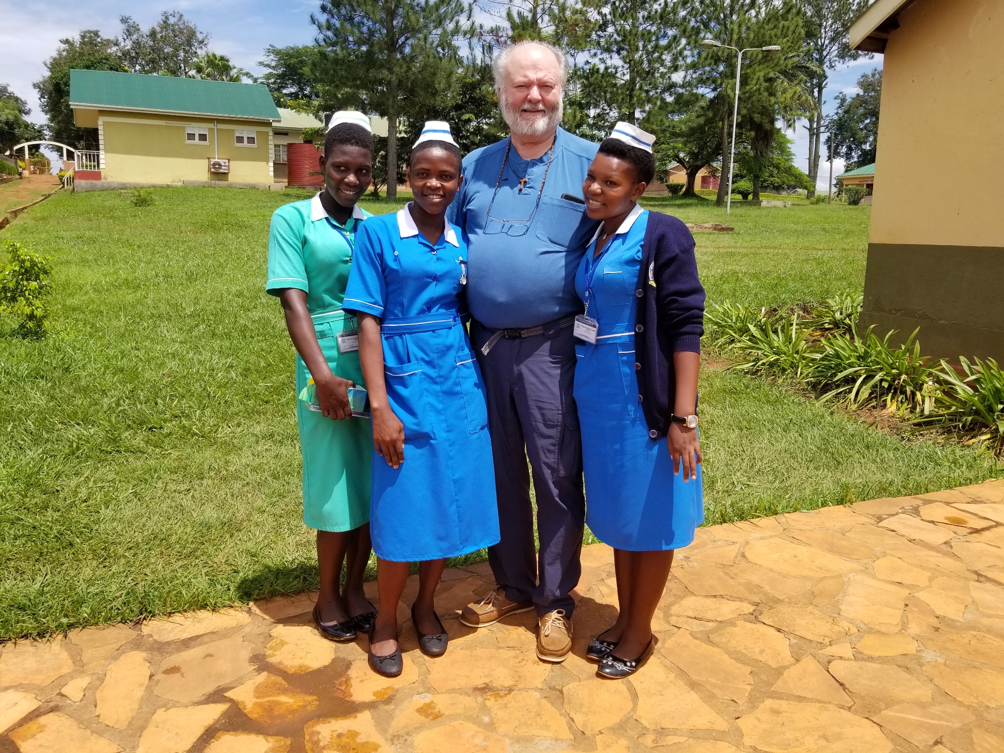 Chris with 3 graduates