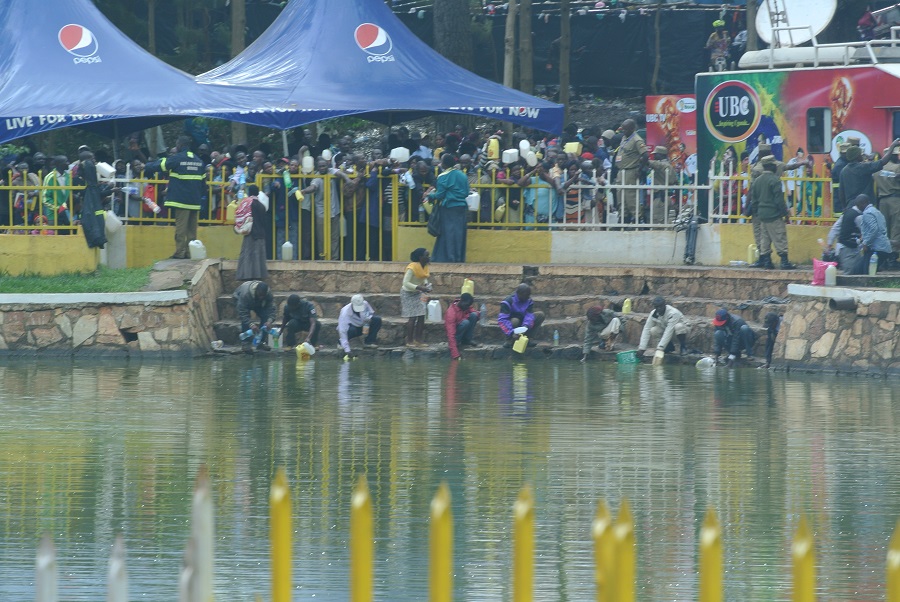 Faithful Catholics drew water from the lake that had been blessed in hopes of bringing healing to their loved ones at home.