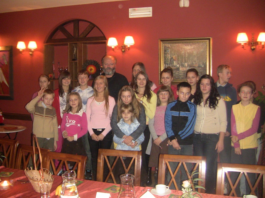 Christopher Hoar gathered with a group of children at a Polish orphanage.