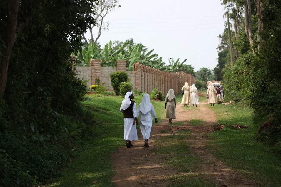 After the funeral, sisters walk home to resume their service in God