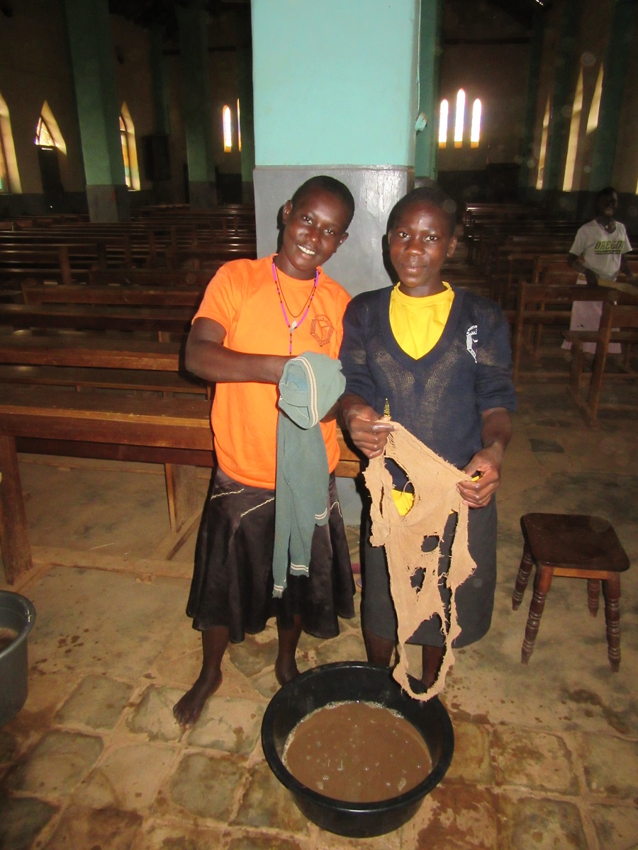 Akoth, sponsored by Pat F. and Agnes, sponsored by Christine R., helped with scrubbing the church floors. 