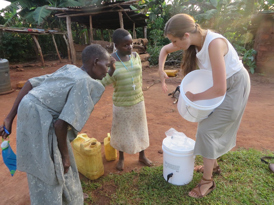 Angela and her oldest grandaughter, Fidelis, listen to Jenny