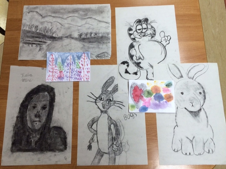 The children are producing artwork.