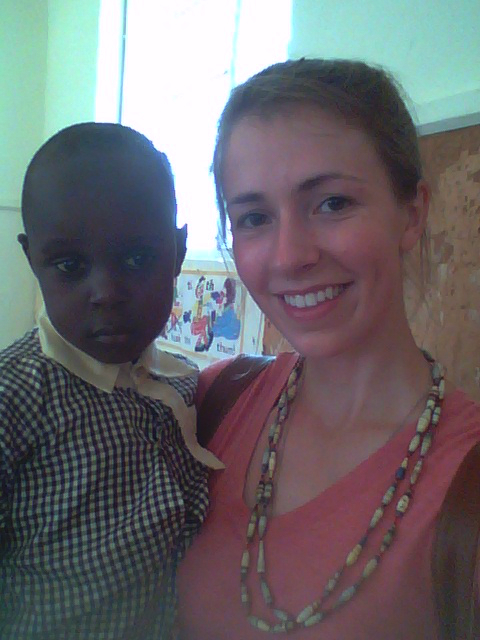 Catherine with Verone, the boy whom her parents support through CARITAS For Children Child Sponsorship Programs. 