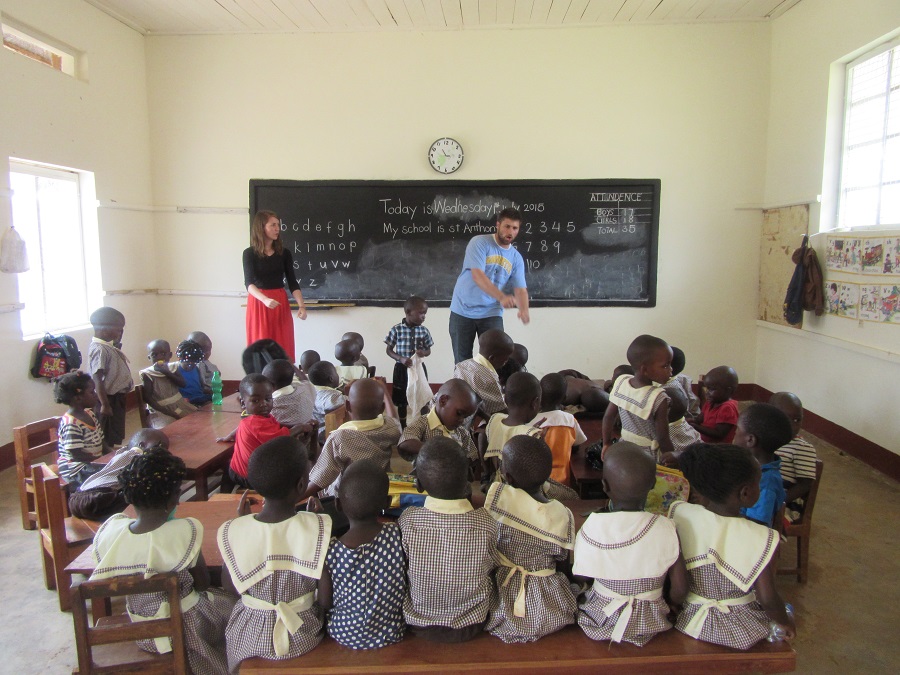 Kollin and I teach the children at St. Anthony a song.
