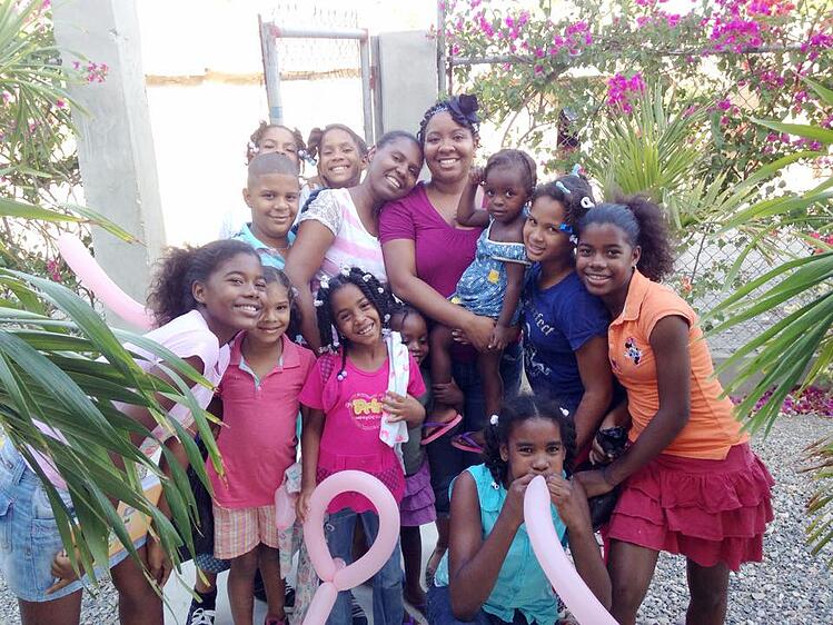 Farron with children in the DR