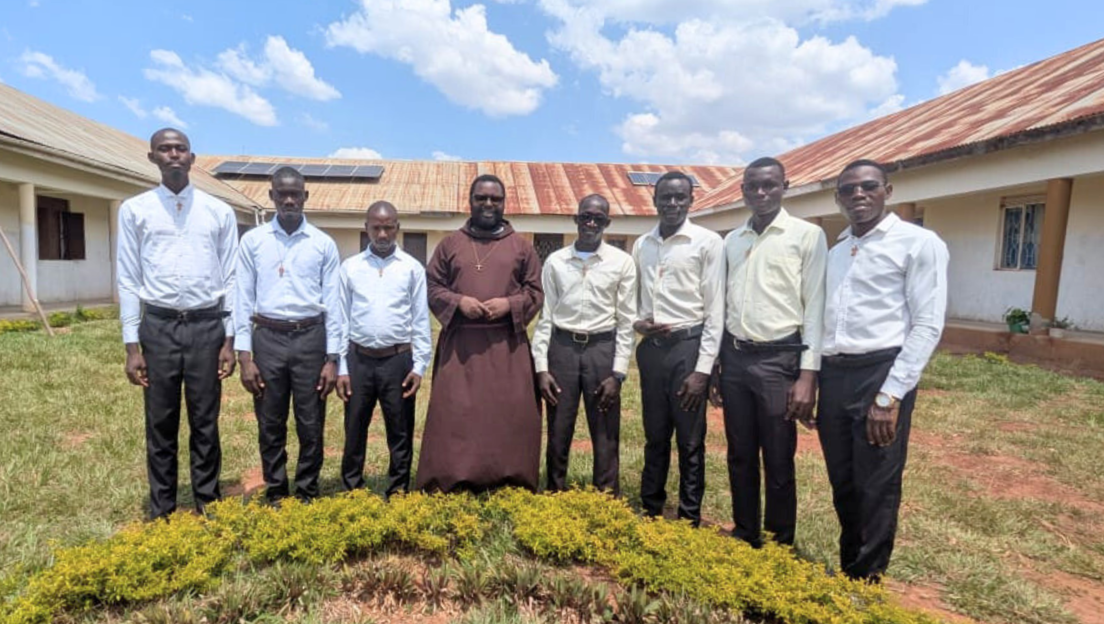 Padre Pio Brothers in front of building