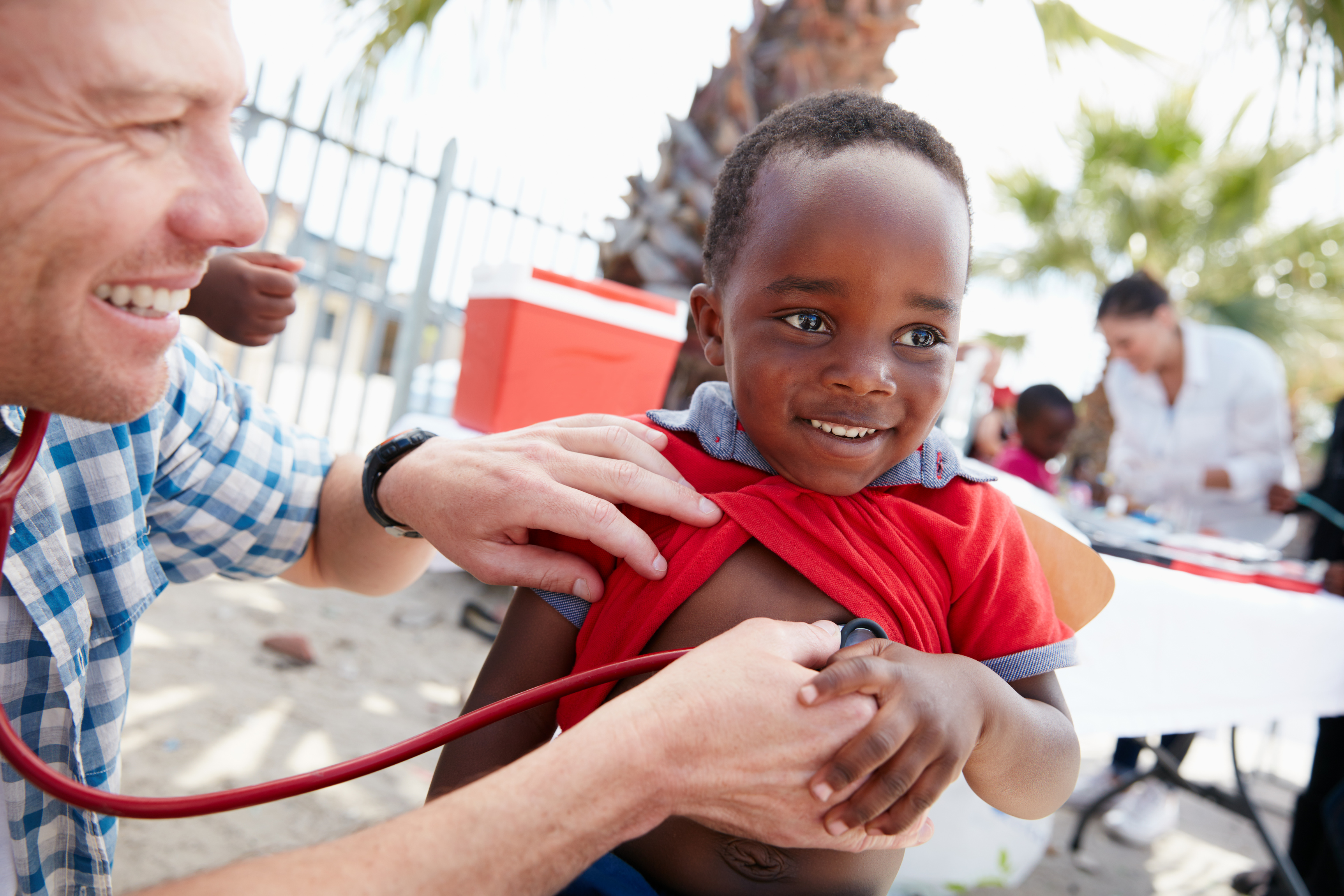 Child with missionary doctor Child with missionary doctor