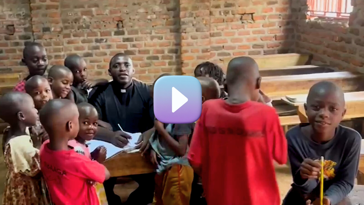 Fr. Frank in a classroom